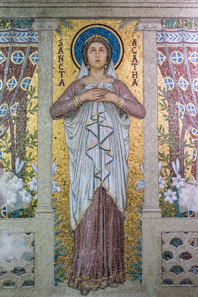 A mosaic of a woman holding a baby